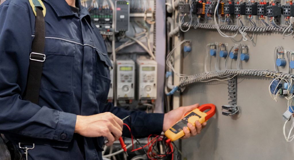 A commercial electrician on work 
