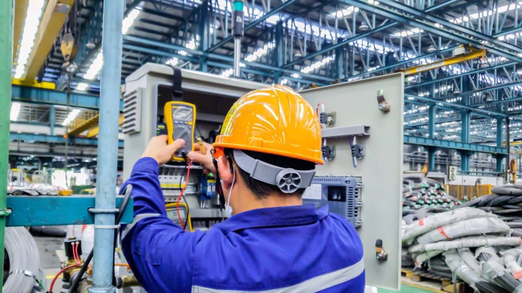 An industrial electrician on work 