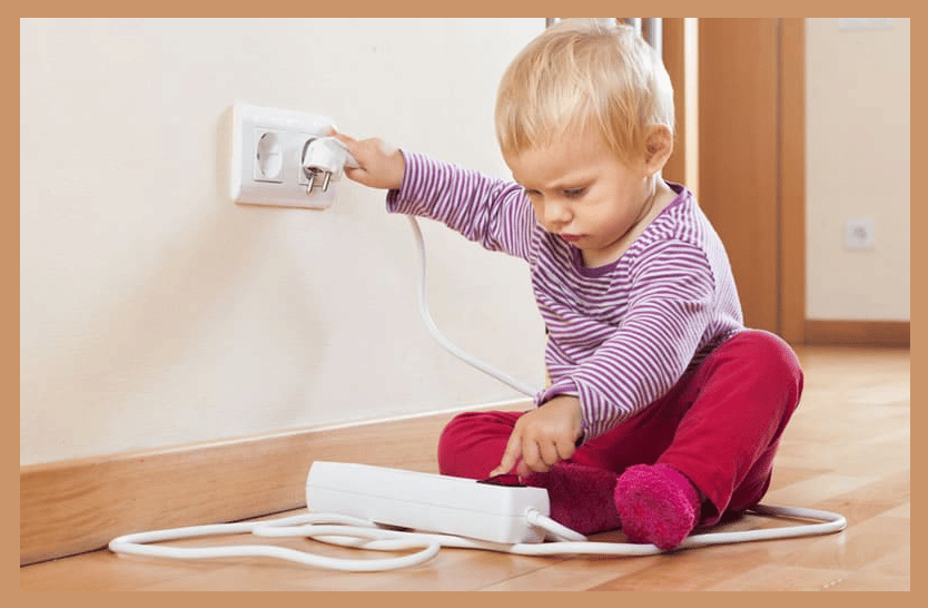 child playing with electrical appliance