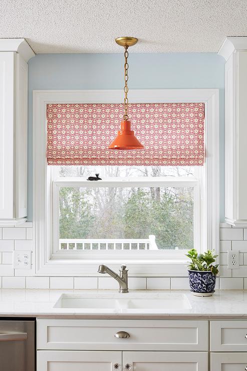 wall sconce above kitchen sink